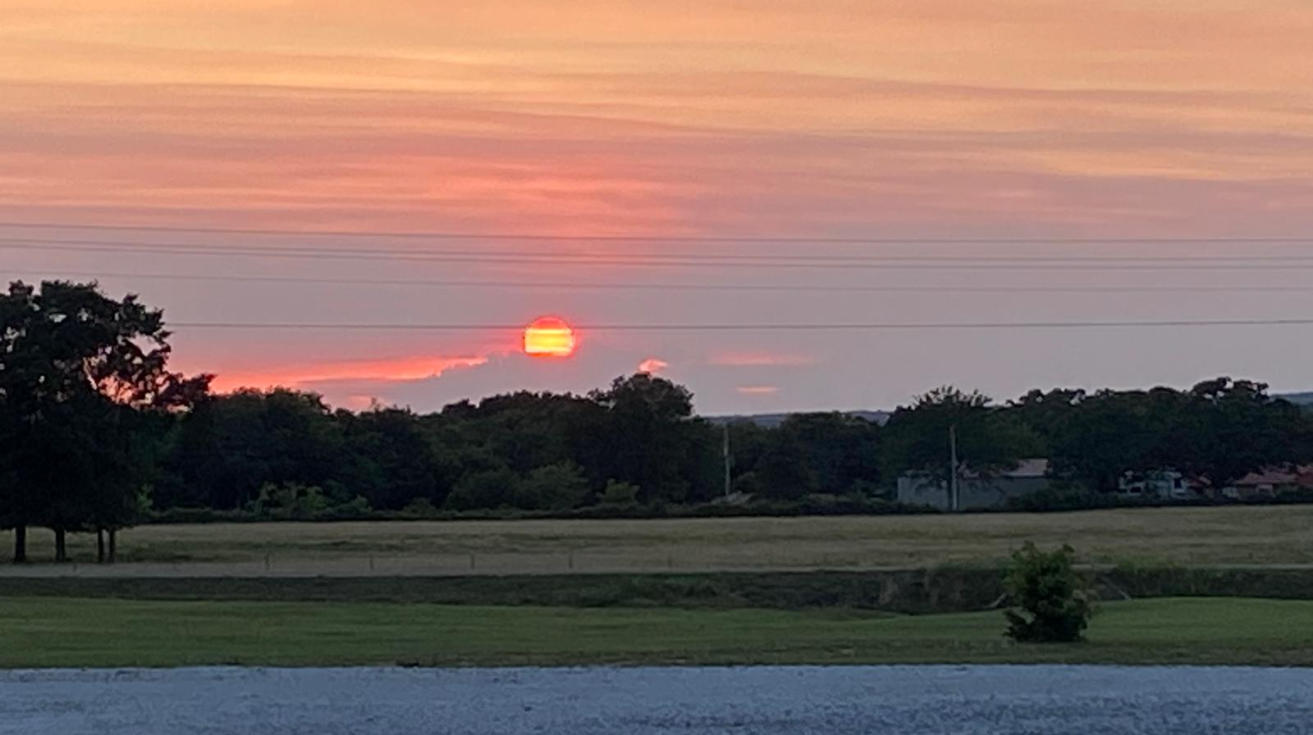 picture of the sun setting from Dantzyn Rv Park.